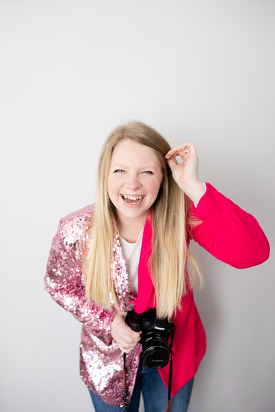 Photographer Mikayla Scott wearing a hot pink sequin blazer