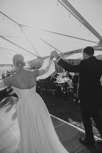 couple walking into their wedding reception space during their montana wedding day 