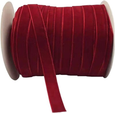Roll of luxurious wide red velvet ribbon for holiday crafts, gift wrapping, and decorating – featured by Sweet Pea Ink Creative.