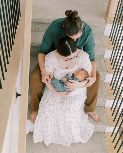 mother holding newborn at home newborn photography