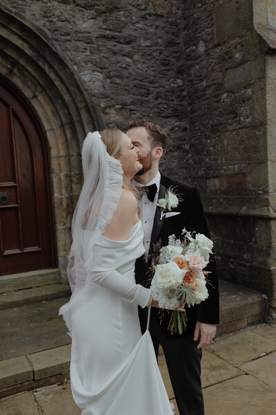 bride and groom kissing outside  at a midlands wedding