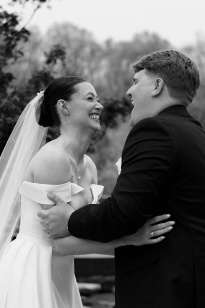 A bride and groom pose for portraits.