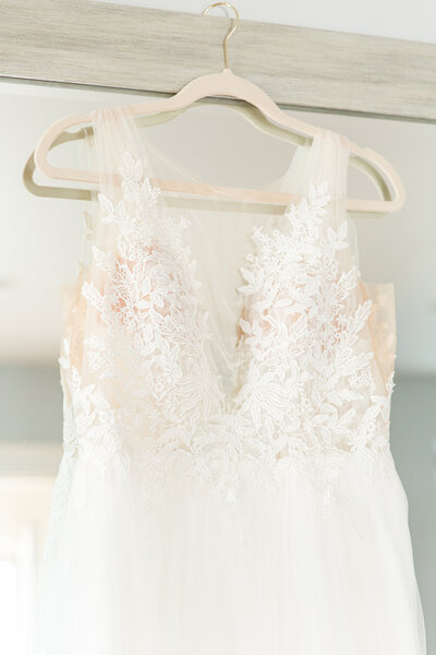 close up of wedding dress on hanger