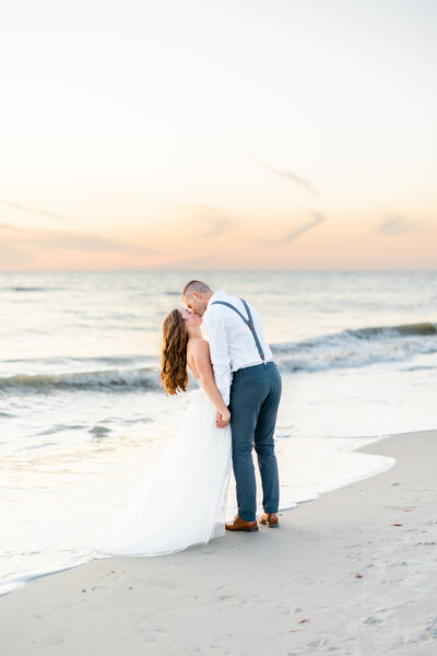 wedding photography miami fl of couple kissing on the beach