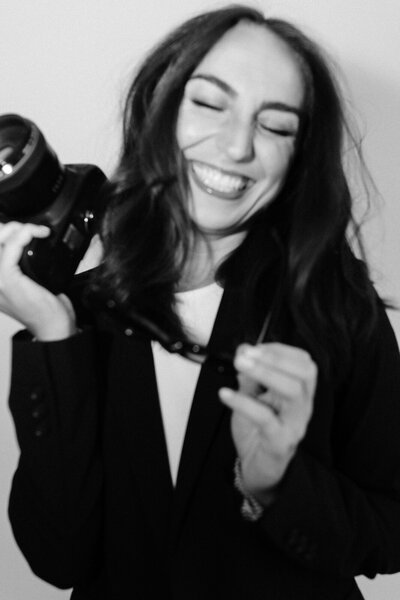 A oklahoma wedding photographer smiling for a portrait.