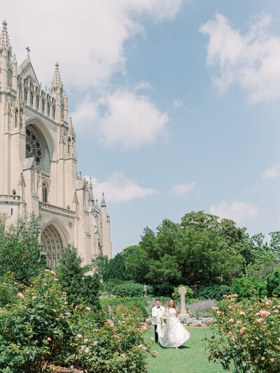 a bride and groom running through garden