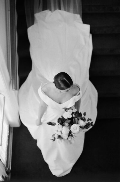 Bride walks down stairs at Rainier Chapter House - Jacqueline Benét