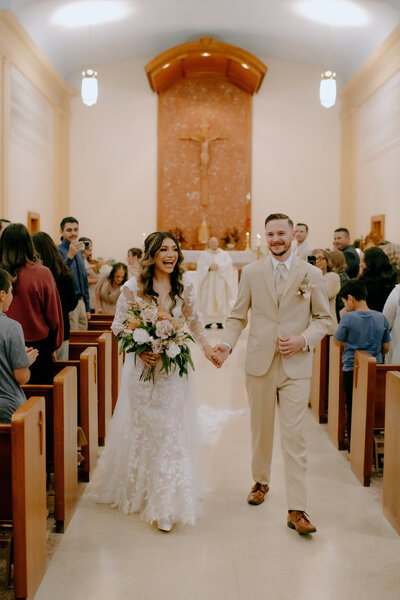 oklahoma wedding photographer documents couple walking out of their ceremony