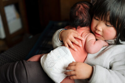 mother holding newborn baby