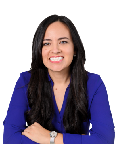 Professional female in purple blouse smiling with arms crossedional in purple blouse smiling with arms crossed