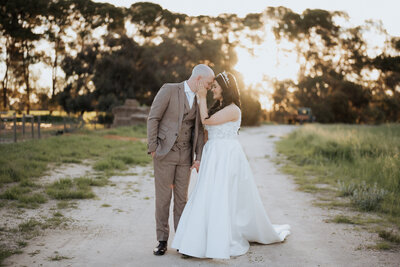 Close-up of wedding rings and decor at an Adelaide wedding, captured by JakeyVass Media