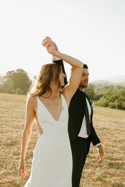 bride and groom sunset photos planned by San Luis Obispo wedding planner