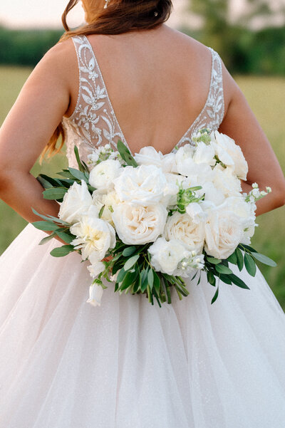 Bride and groom twirling in wedding gown by Vow'd Nashville in Nashville, Tennessee