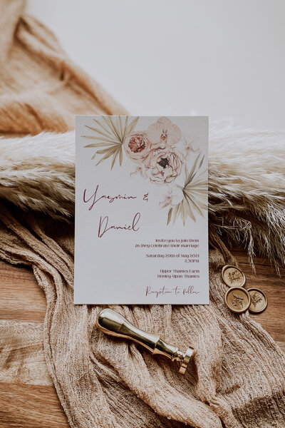 Boho floral wedding invitation in nude and burgundy