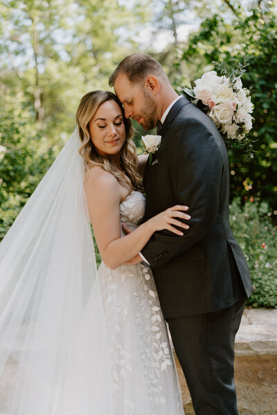 groom leaning onto the bride