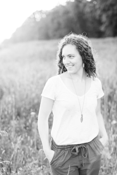 black and white photo woman in country field