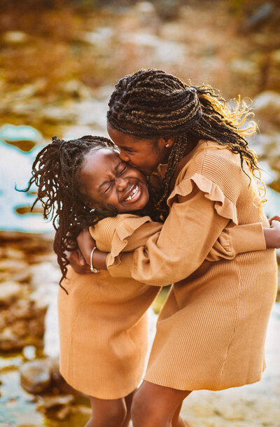 Siblings loving each other for family photos