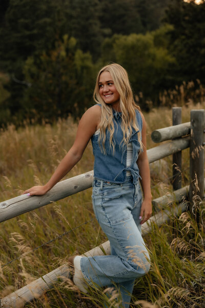 Engagement photo of a couple at sunset in Wyoming, with a romantic outdoor setting and soft natural lighting.