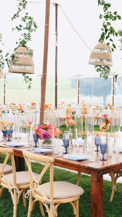 bright and vibrant wedding reception with bright forals