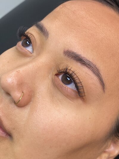 This portfolio image showcases classic lash extensions created at Book Sothana in Jacksonville, FL. Classic lashes are ideal for clients who want a soft, elegant enhancement to their natural lashes without the drama of volume or mega-volume styles. Each extension is carefully applied one-to-one on your natural lashes, creating a clean, defined look that beautifully frames the eyes. Licensed esthetician Sothana customizes every set to match your lash length, curl preference, and personal beauty goals. Clients love the light, comfortable feel of classic extensions and how seamlessly they blend with their natural lashes. Book Sothana’s private Jacksonville studio offers a relaxing and professional setting for all beauty services, including lash lifts, waxing, facials, and makeup artistry. Located at 9303 Baymeadows Rd 105, #120, Jacksonville, FL 32256. Call (904) 597-0867 or visit https://booksothana.com/ to book your classic lash extension appointment today!