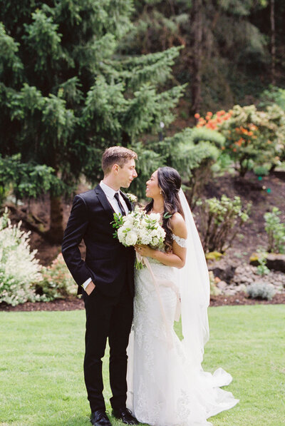 Emily and Austin gazing into each other eyes at an wedding venue in Portland.