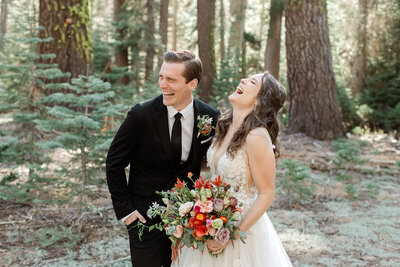 A bride and groom overflow with laughter as they see each other for the first on their Mammoth Lakes Wedding day.