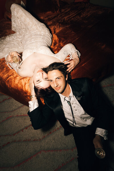 editorial image of a couple and getaway car at their Joshua Tree desert wedding, captured by Los Angeles documentary wedding photographer