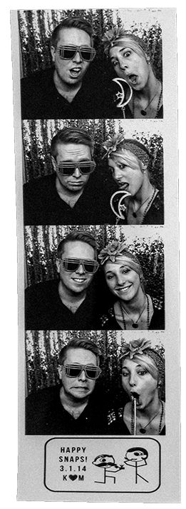 man and woman in wedding photobooth