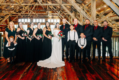 Portrait of bride and groom with wedding party at Snowline Acres in Kalispell, MT