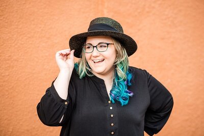 Mahlia of Ivory Door Studio wearing a cute hat posing for a portrait