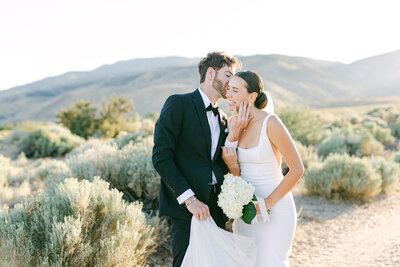 Bride and Groom embrace .