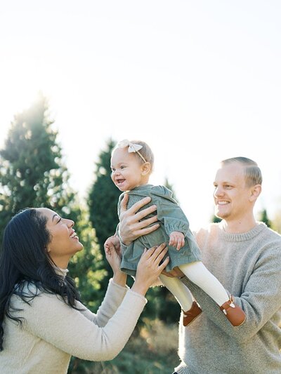 Toddler boy kisses baby girl's cheek in Maryland family session.