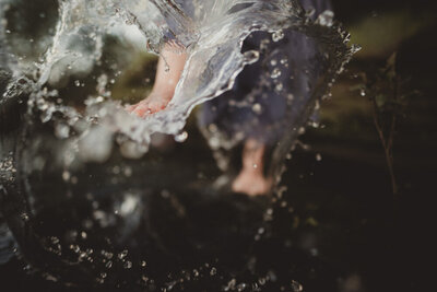 Caroline Weiss splashing water, embodying tranquility and connection to the elements.