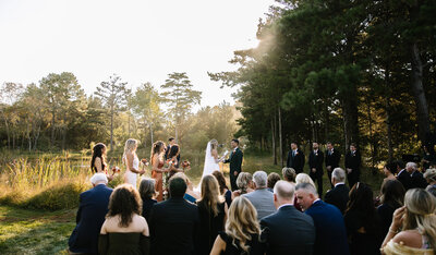 Golden sun Bride and groom with veil flowing