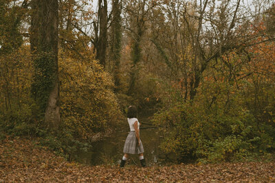 girl sitting next to pond in newberg, oregon