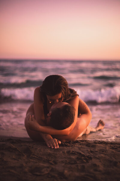 couple kissing and eloping on a mountain in the french alps