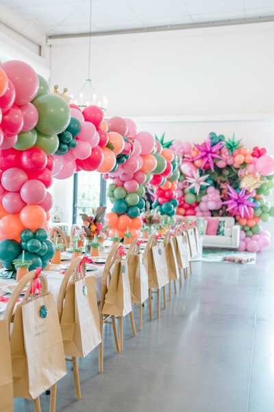 bright balloon centerpieces down table