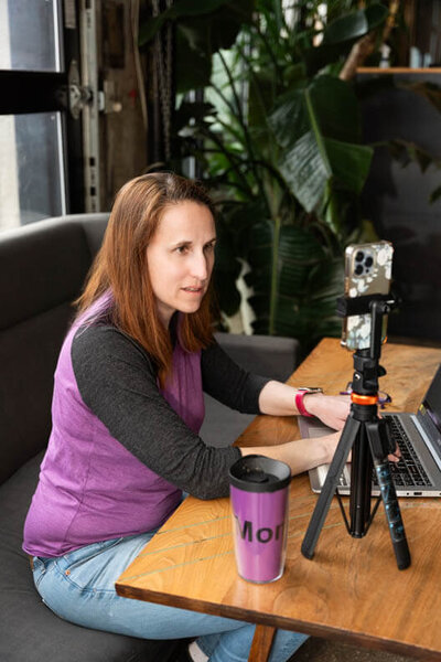 social media manager on the call with a client  in a cafe taken by olya photographer