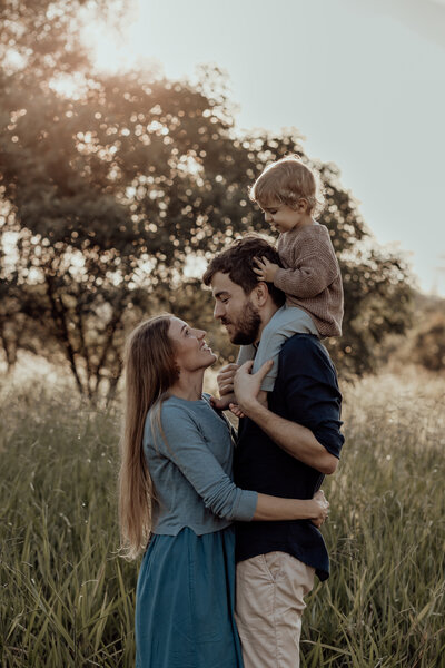 Brisbane family photo, family of three at sunset, field photography