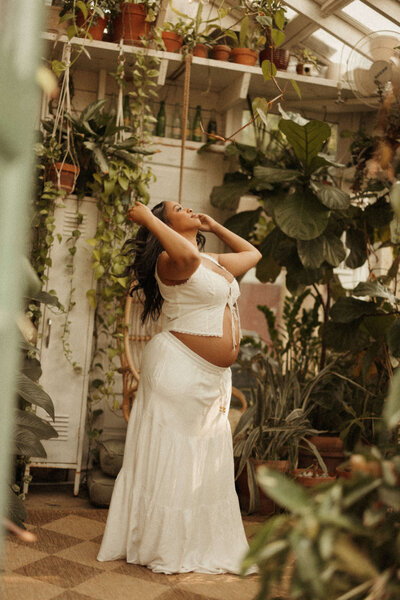 pregnant mama in the golden glow in the east nashville greenhouse 