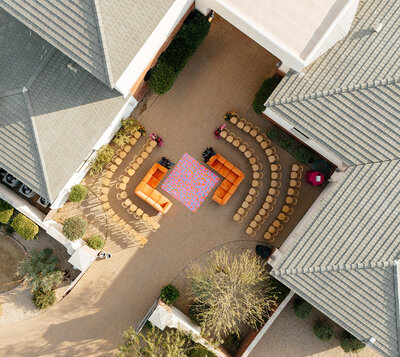 Aerial shot of outdoor wedding ceremony setup planned by Bloom & Blueprint