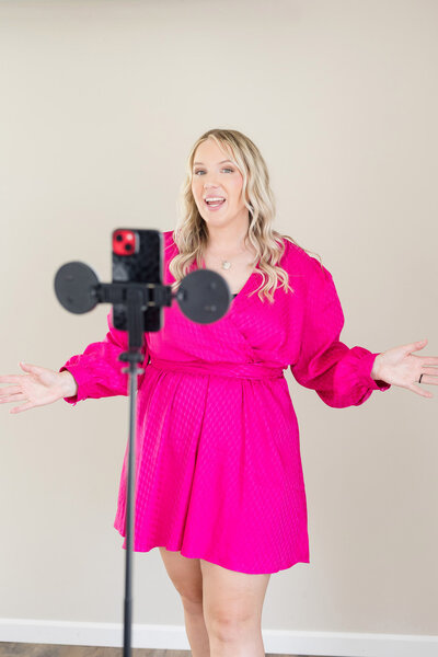 Becca speaking in front of her video recording equipment.