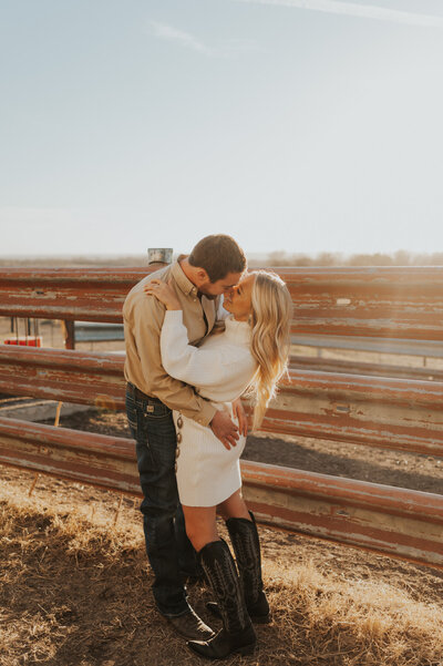 couple embracing in the grass