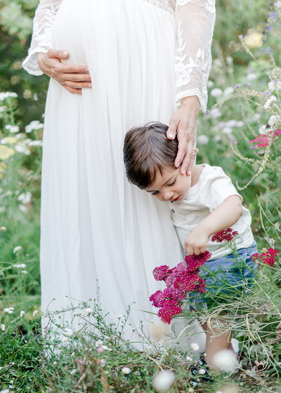Garden Maternity with little boy are flowers