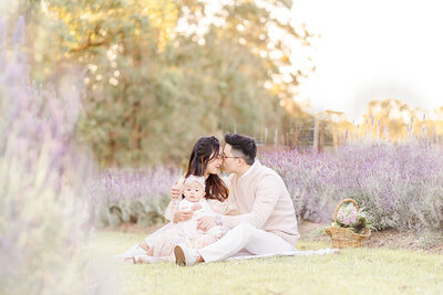 Asian family sitting in lavender field with dreamy light in Brisbane southside.