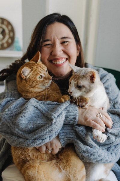 jennifer kahl holds her cats