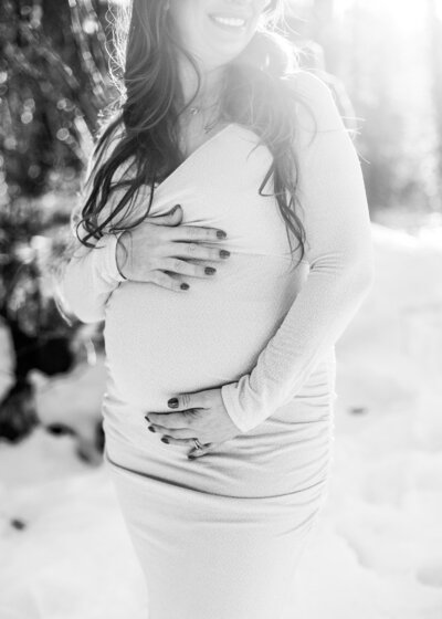 Black and white image of pregnant woman photographed my portland maternity photographer.