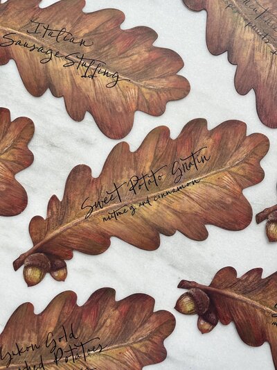 Oak leaf food signs with black calligraphy