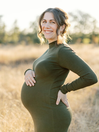 Amanda Mirabella pregnancy photo in a green dress