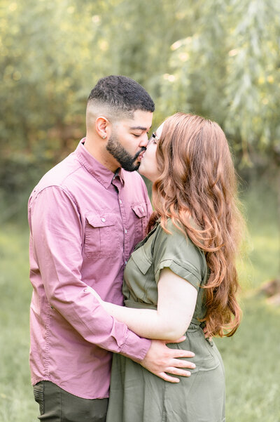 Couple kissing during engagement session in Hudson Valley